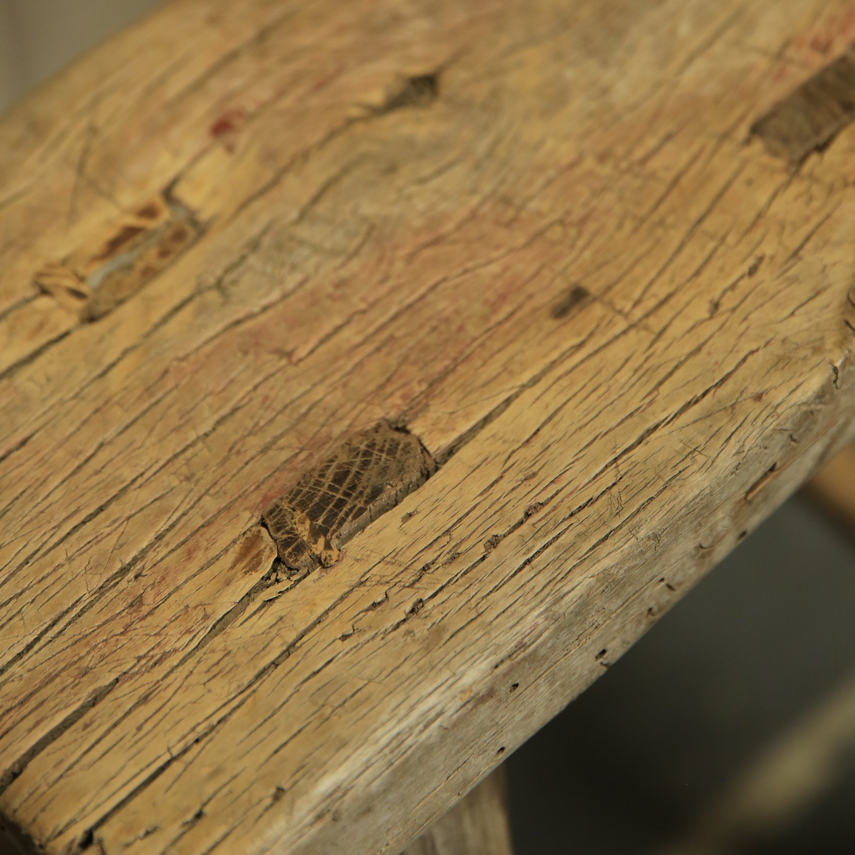 Close-up of a wooden surface with visible grain and texture