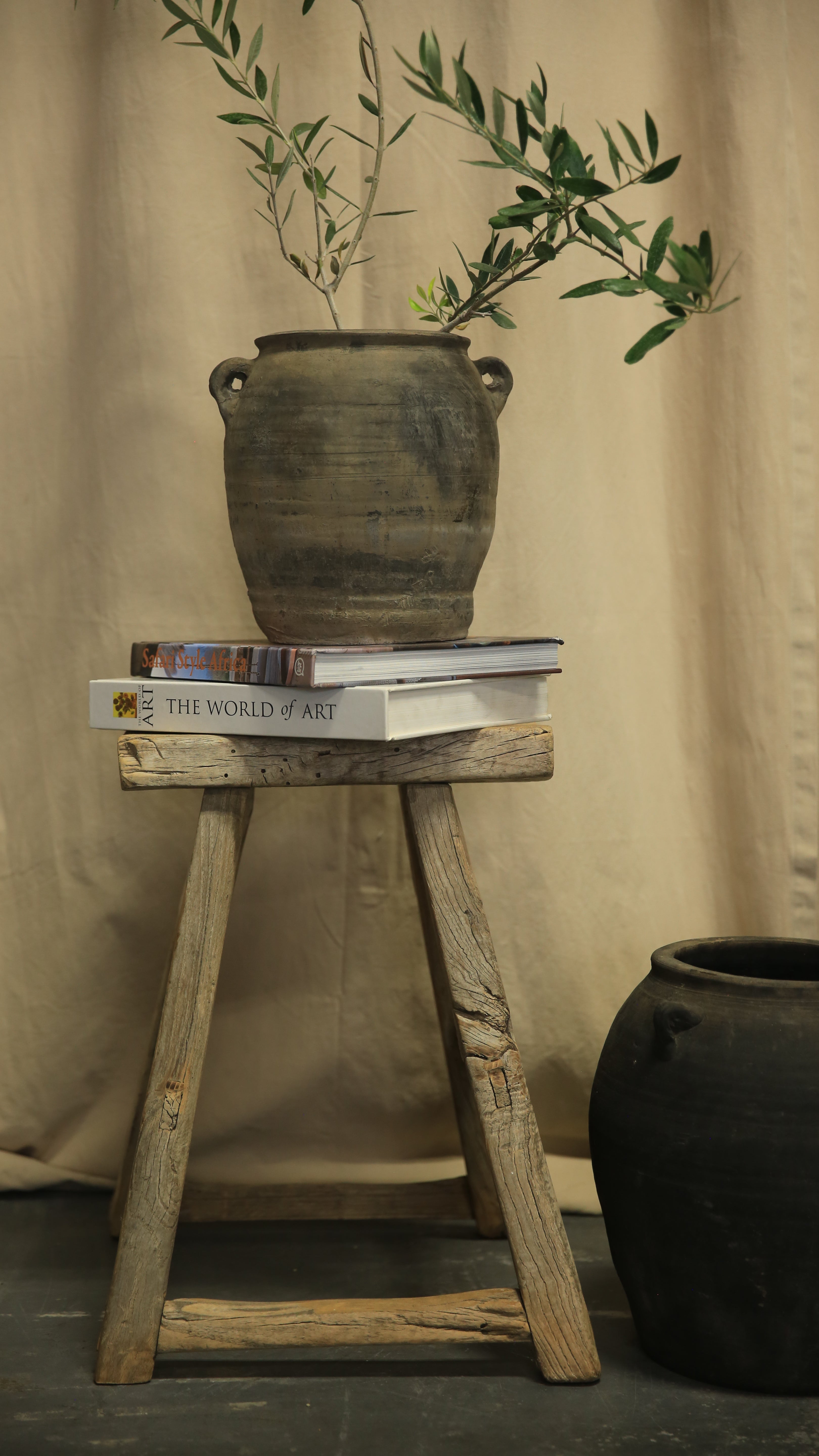Vintage wooden chair with a book on a neutral background