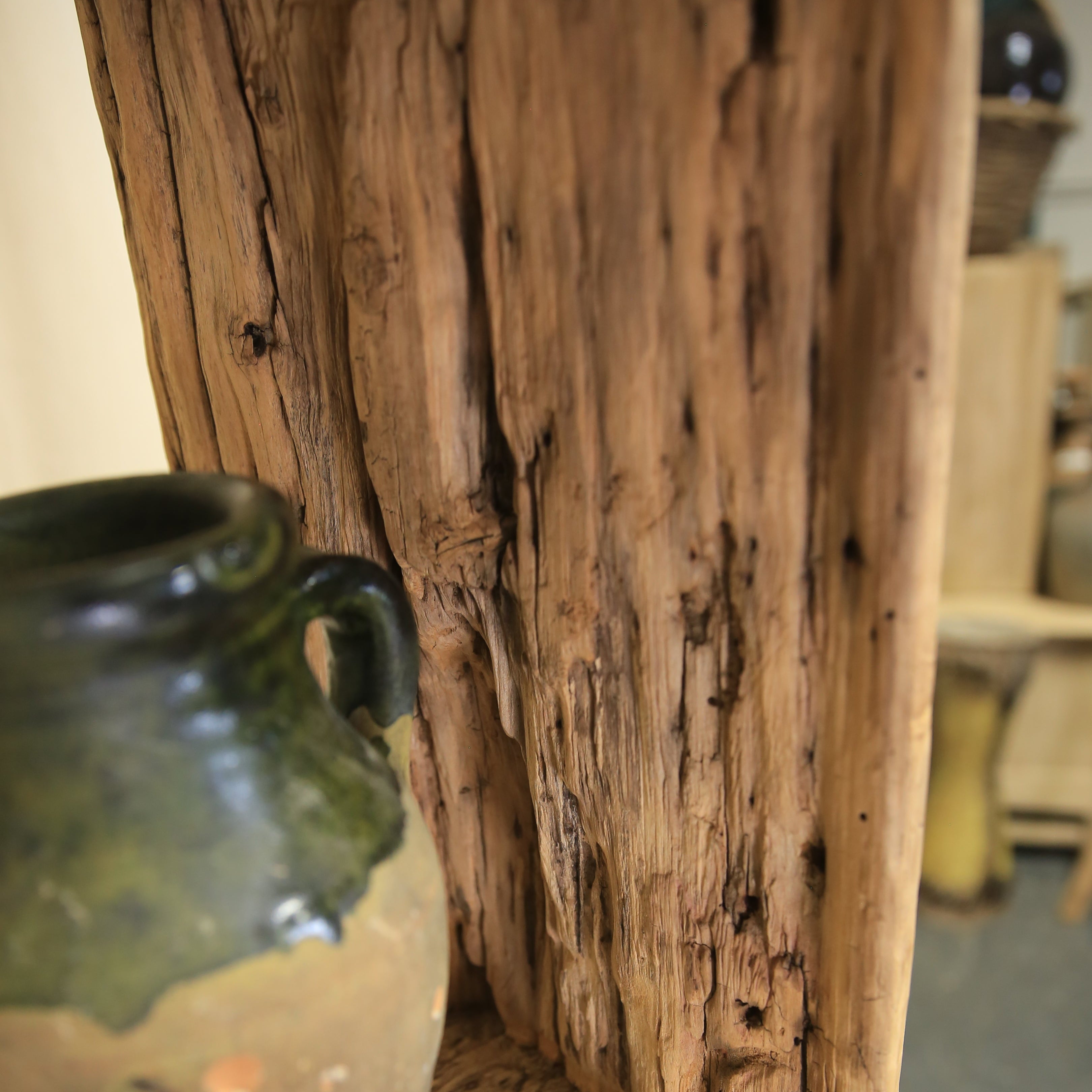 Green glass bottle on a wooden surface