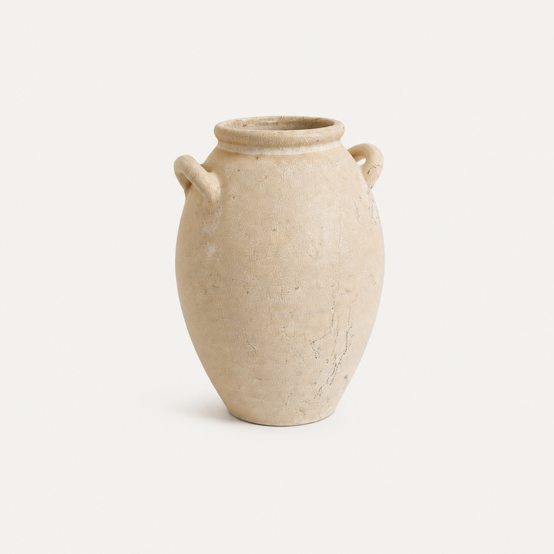 Beige ceramic vase with two handles on a white background