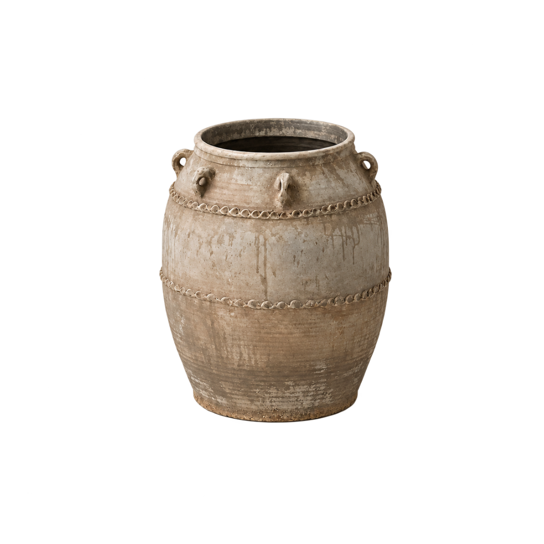 A rustic ceramic planter pot with a textured, distressed finish in earthy beige and brown tones, featuring decorative chain-like bands and side handles, isolated on a white background.
