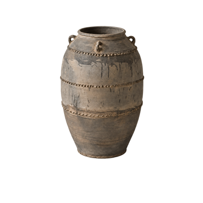 A rustic, vintage-style ceramic vase with a distressed brown and gray finish, featuring decorative metallic-looking beaded bands and loop handles near the rim, set against a plain white background.