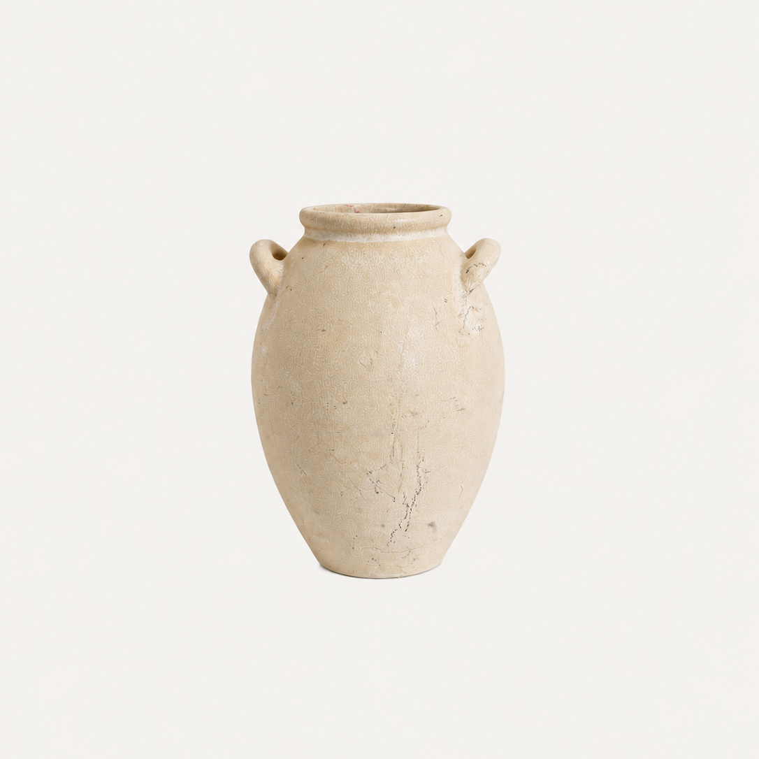 Beige ceramic vase with two handles on a white background